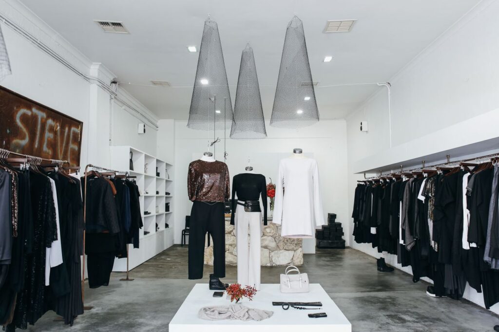 Chic boutique with elegant clothing display and stylish interior design.